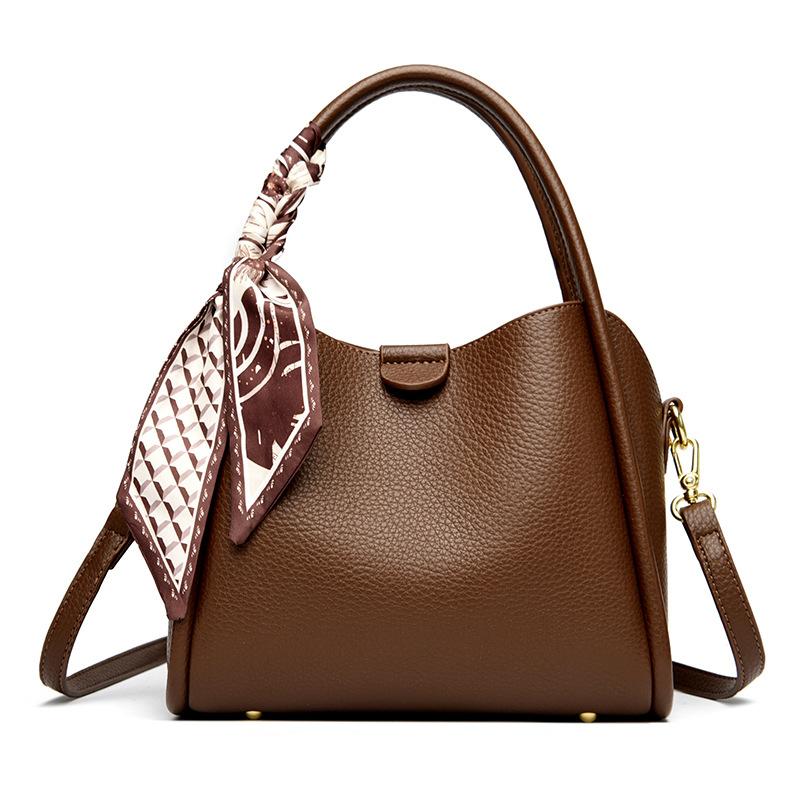This Bucket Bag Is A Simple and Fashionable Urban Design with A Lychee Pattern and A Silk Scarf. It Is A Hand-held Shoulder Bag
