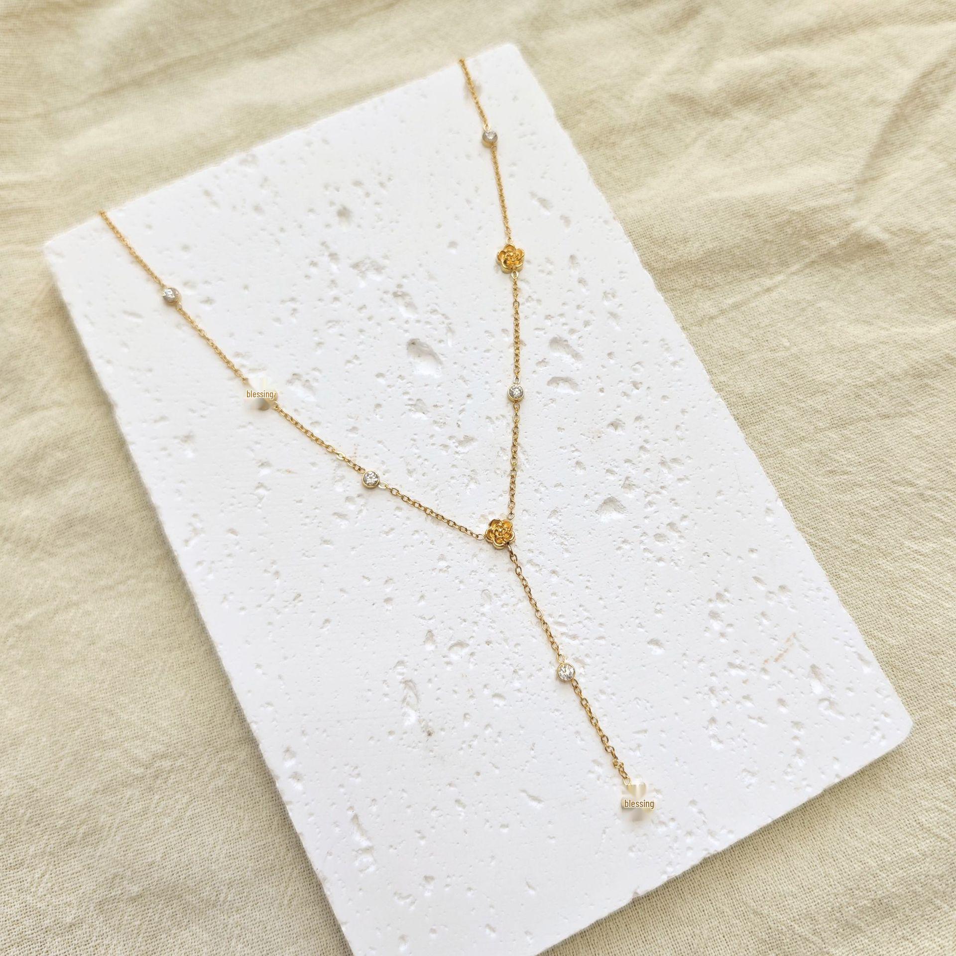 European Gold Camellia Zirconia Tassel Necklace - Elegant Y-shaped Design for Women золотой