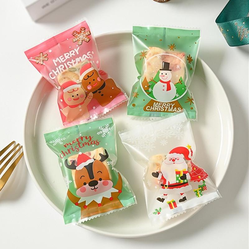 100Pcs 7x10cm Plastic Christmas Machine Sealed Bags Snowflake Pastry Candy Cookie Xmas Party Gift Packaging Supplies