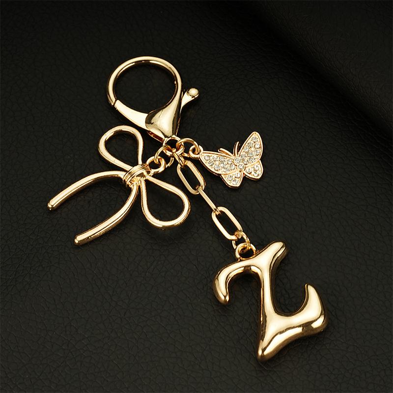 Chaveiro Fashion Borboleta Letra A-Z Feminino Menina Brilhante Fofo Mochila Chave de Carro Acessórios Cordão Pingente de Metal com Letra Presente
