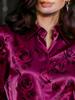 An elegant women's all-purpose blouse made of silk with a floral pattern, suitable for suburban trips.