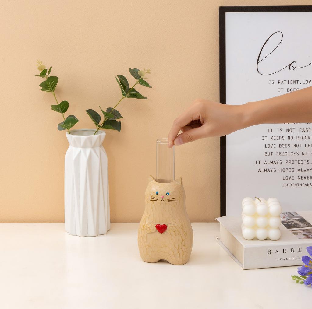 A cat shaped storage pen holder with heart-shaped decorative statues and multifunctional vase decorations
