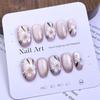 Hot-Selling Hand-Painted Floral Cat Eye Nail Tips - Ice Transparent Nude, Gentle Style Wearable Nails.
