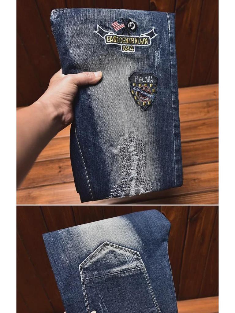 Men's Slim-Fit Embroidered Floral Distressed Jeans with Patches and Elastic Trim.