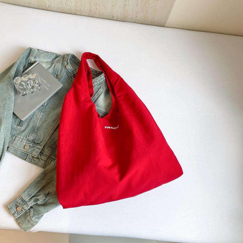 Large-capacity tote bag women's 2025 new simple solid color lazy wind shoulder bag casual commuting shopping cloth bag