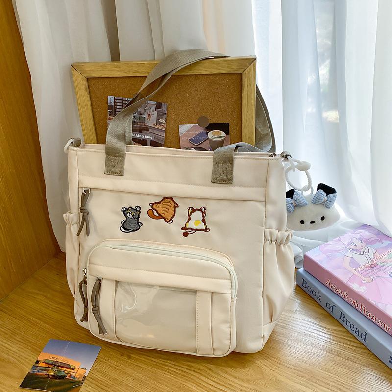 Cute messenger bag women's 2025 new Japanese pain bag large-capacity shoulder bag girl junior high school student portable tote bag