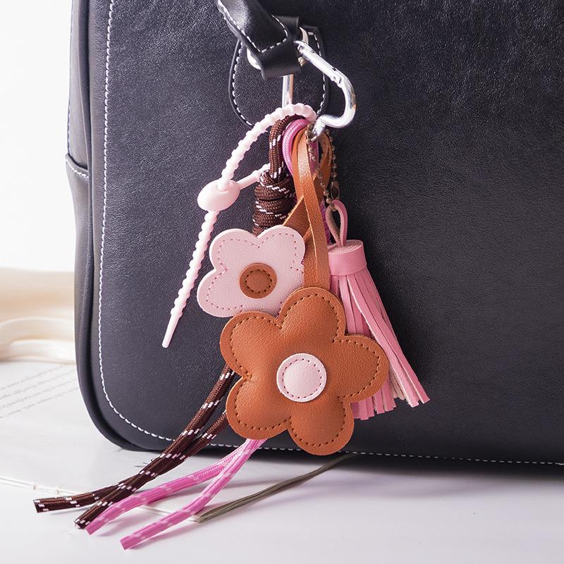

Yogodlns Exquisite Cute Faux Leather Flower Tassel Braided Rope Bag Charms Pendant For Handbag Purse Backpack Accessories one size рожевий/коричневий