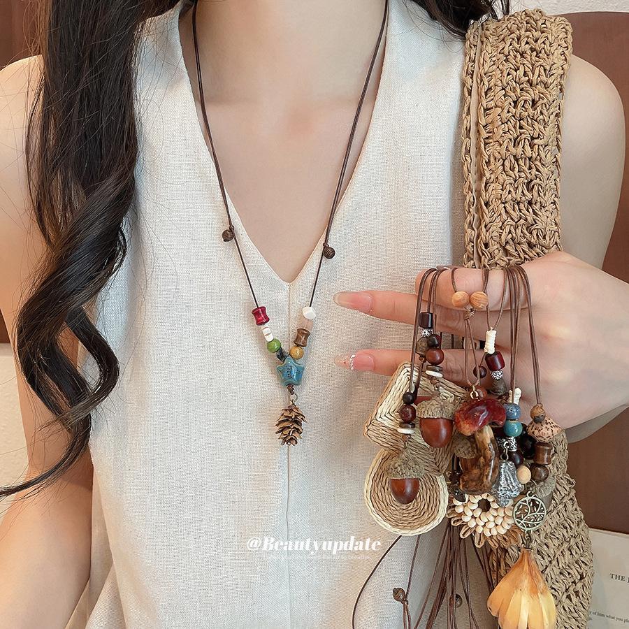 Ethnic Retro Leather Rope Raffia Necklace: Pine Cone & Mushroom Design, High-End Fashion Sweater Chain for Women
