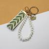 Trending 2025 Keychain Set Fashion Minimalist Pearl Car Keychain Woven Stripe Bag Charm Elegant Women Keychain Organizer Gift