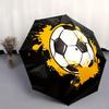 Ce parapluie compact présente un grand motif de ballon de football orné d'éclaboussures jaunes sur un fond géométrique noir.. Id