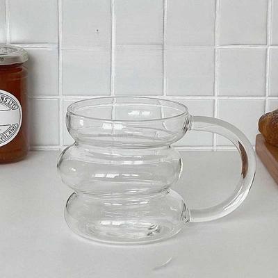 Neue transparente Glas-Kaffeetasse Irreguläre Raupenform Frühstückstasse mit Henkel Hitzebeständiges Glas Latte-Tasse