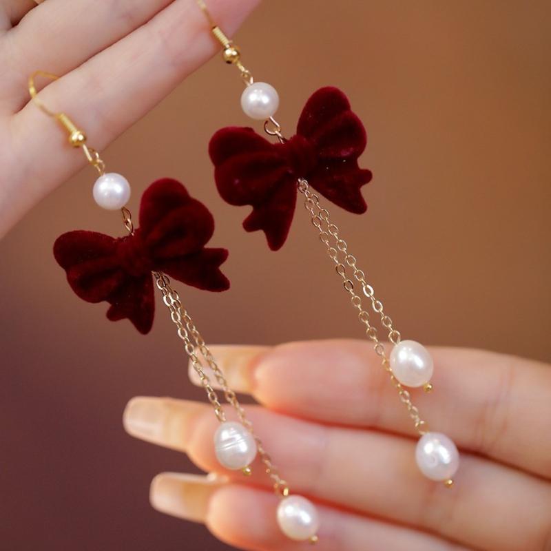 Autumn and Winter New Bow Imitation Pearl Tassel Earrings, Suitable for Women's Holiday Party Accessories and Gifts