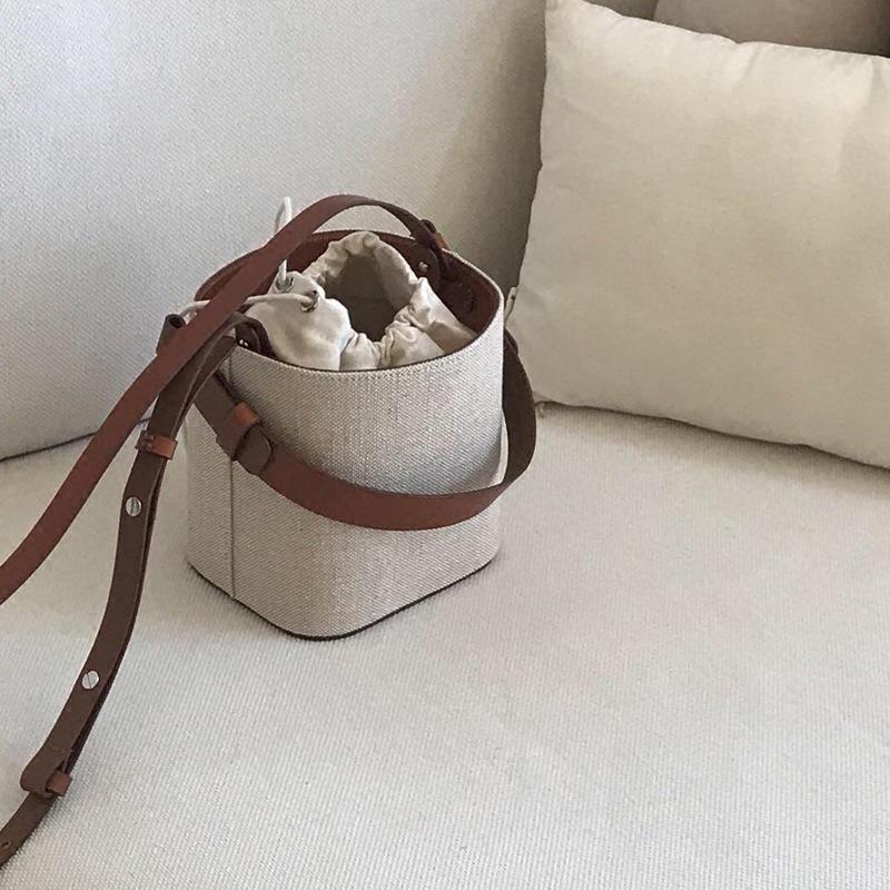 

South Korea Dongdaemun new ins summer new canvas leather bucket bag contrasting small bag shoulder messenger women s bag
