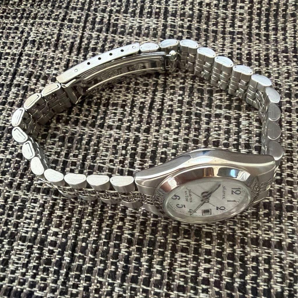 Used and unused CITIZEN sharex Solartech wristwatch silver dial
