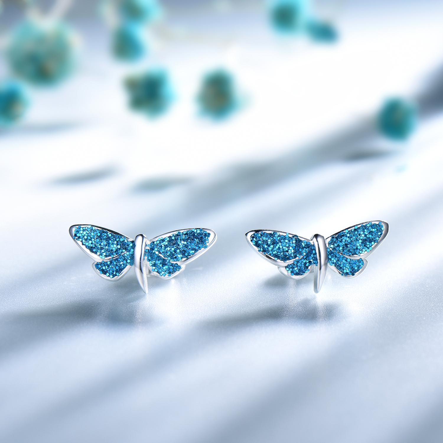 

Серьги-гвоздики из серебра 925 пробы с синими блестками и не тускнеющим покрытием в форме бабочки синий