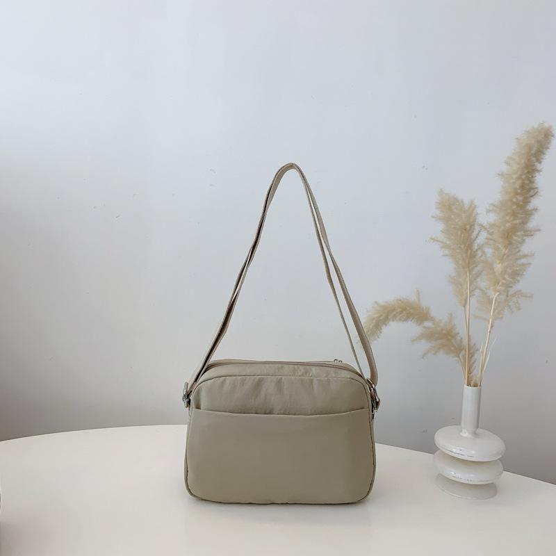 

2025 новая женская сумка-мессенджер ленивая и расслабленная повседневная корейская версия нишевая уличная многослойная большой вместимости многослойная модная хаки