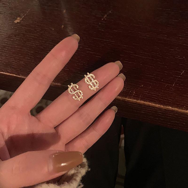 Exquisite Euro-Style Rhinestone Dollar Sign Stud Earrings – Versatile, Luxurious Jewelry for Women.