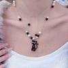 Black Kitten Collarbone Chain: Black & White Pearl Beaded Necklace with Contrasting Colors for Women - Niche Design Sweater Chain
