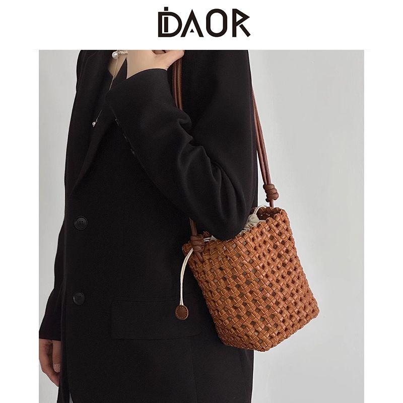 

Daor Vegetable Tanning Leather Hand-Woven Bag 2025 Summer New Arrival Cut Out Bucket Bag Women s Shoulder Messenger Bag Cookie Brown