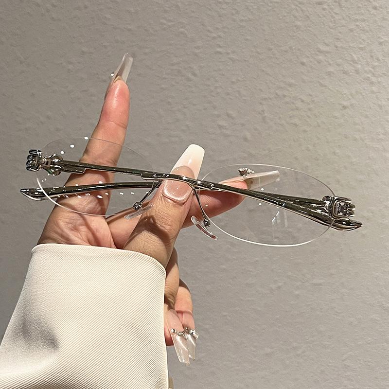New elliptical frameless metal temple YK knot women's sunglasses personalized street shot Internet celebrity sunglasses