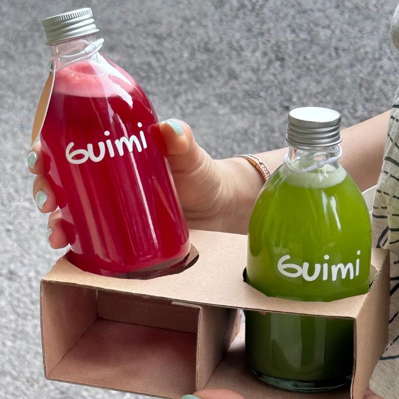 Transparent Round Glass Bottles with Lids for Juice, Milk, Tea, Cold Brew, and Coffee.