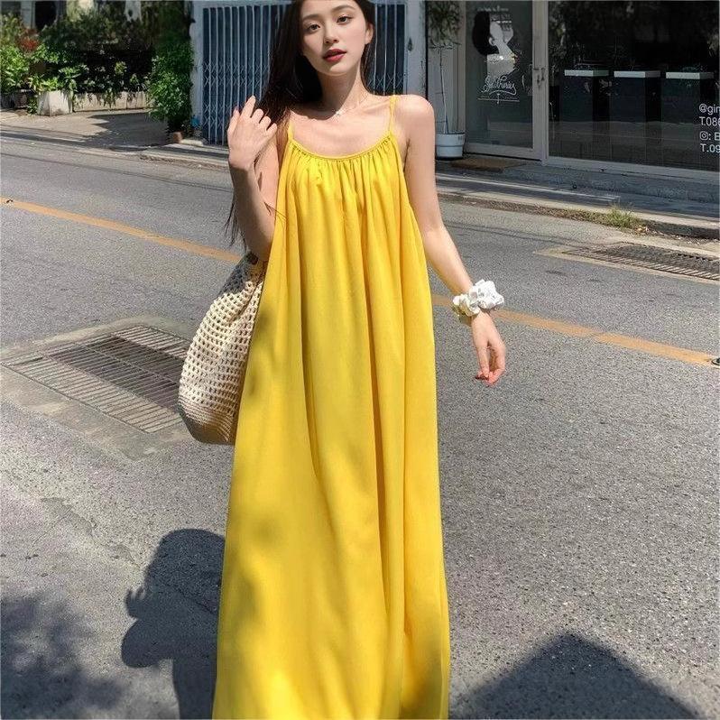 Seaside vacation sexy backless suspender dress women's summer new loose a-word skirt gentle yellow long skirt