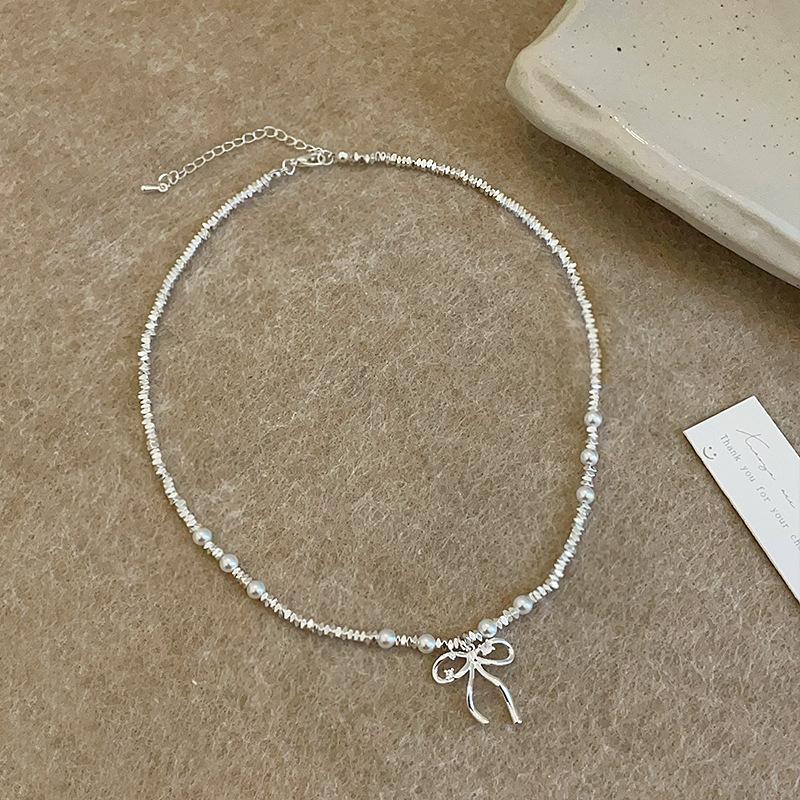 

Легкое роскошное высококачественное серебряное жемчужное ожерелье-бантик для женщин, простая элегантность, мода, универсальная цепочка на шею, цепочка на ключицу