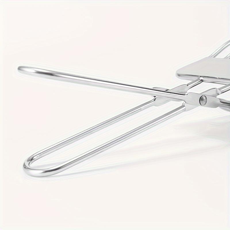A Stainless Steel Beef Slicing Tongs For Cutting Meat And Bread Slices, Onion And Tomato Clip, Used For Cutting Vegetables And Fruits In The Kitchen.