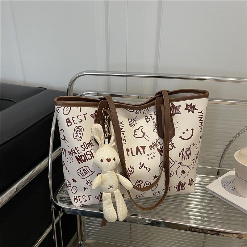 Printed fashion commuting large capacity new personalized pendant autumn popular casual shoulder tote bag