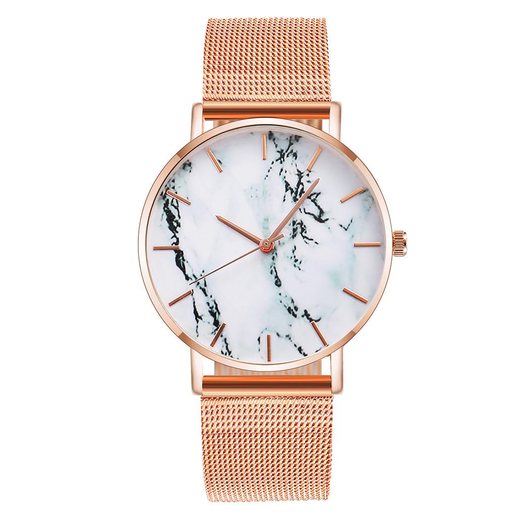 

Креативний жіночий годинник зі сплавним сітчастим поясом і кварцовим круглим циферблатом рожевий колір золота