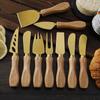 Golden Stainless Steel Cheese Knife with Rubber Wood Handle - Includes Cheese Fork, Spoon, Shovel, and Cream Spreader