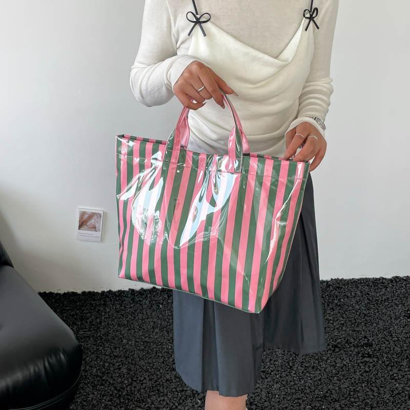 This Water-Resistant Pvc Tote Bag Features A Pink And Blue Striped Design, A Large Capacity, And Is Suitable For Beach Shopping,