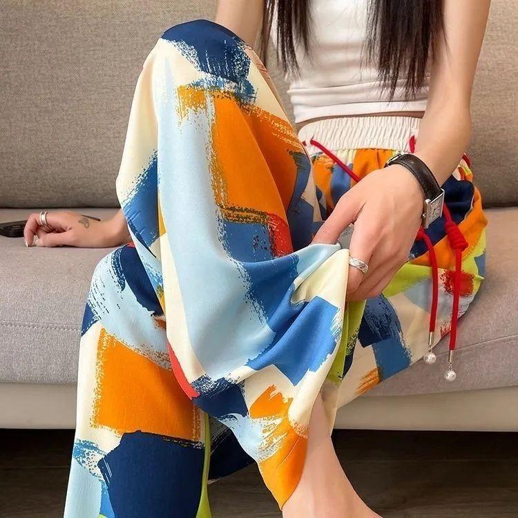 Dámské letní tenké ledově hedvábné ležérní kalhoty s širokými nohavicemi - Volné splývavé kalhoty s vysokým pasem, s batikou, zeštíhlující, rovné