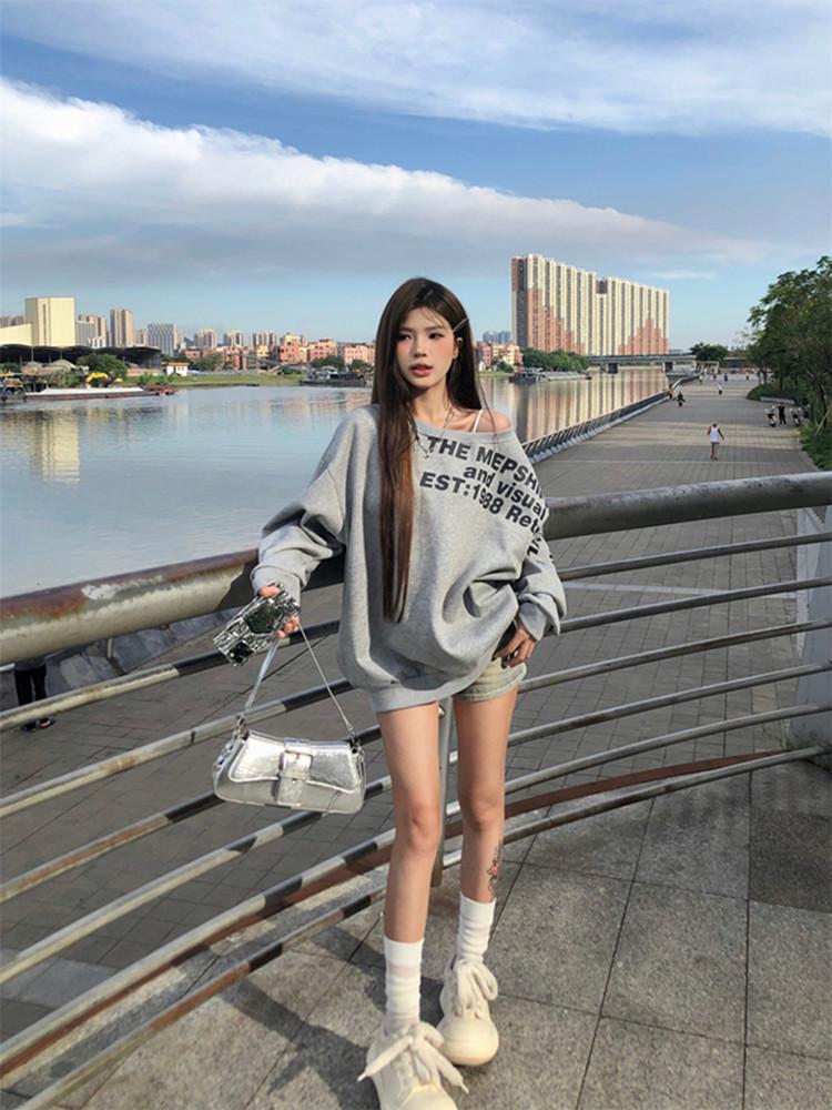 American-Style Oversized Off-Shoulder Sweater: Letter Print, Long Sleeve, Casual Loose Fit for Women In Early Autumn.