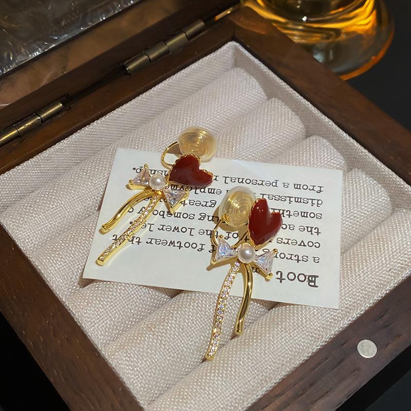 

Love bow tassel earrings high-end drip earrings women s red fashion autumn and winter mosquito coil disc earclips