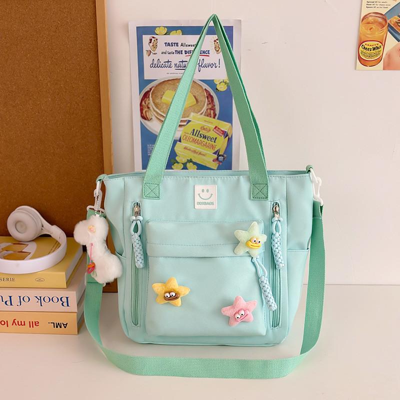 

Stylish And Spacious Anime Nylon Shoulder Bag For Everyday Use And School зелений