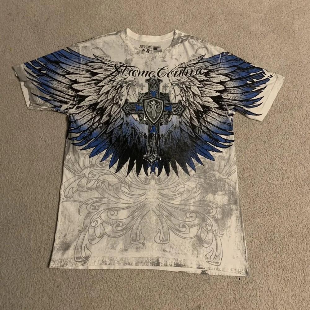 Moda estiva uomo europea e americana stampa teschio con lettere T-shirt comoda e traspirante con scollo rotondo top da esterno per strada