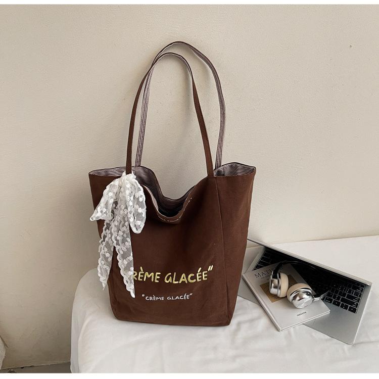 

Canvas bag women s 2025 new simple fashion lightweight shoulder bag large capacity tote bag class commuter bag темно-коричневого