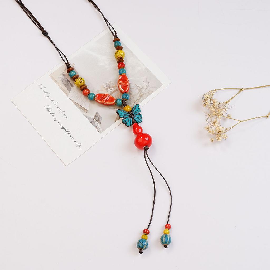 Ethnic style ceramic butterfly bell pendant necklace design sense new trendy long sweater chain