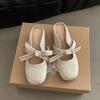Inner heightening bag head half slippers women's summer outer wear 2025 new retro suede bow pearl Muller cool slippers
