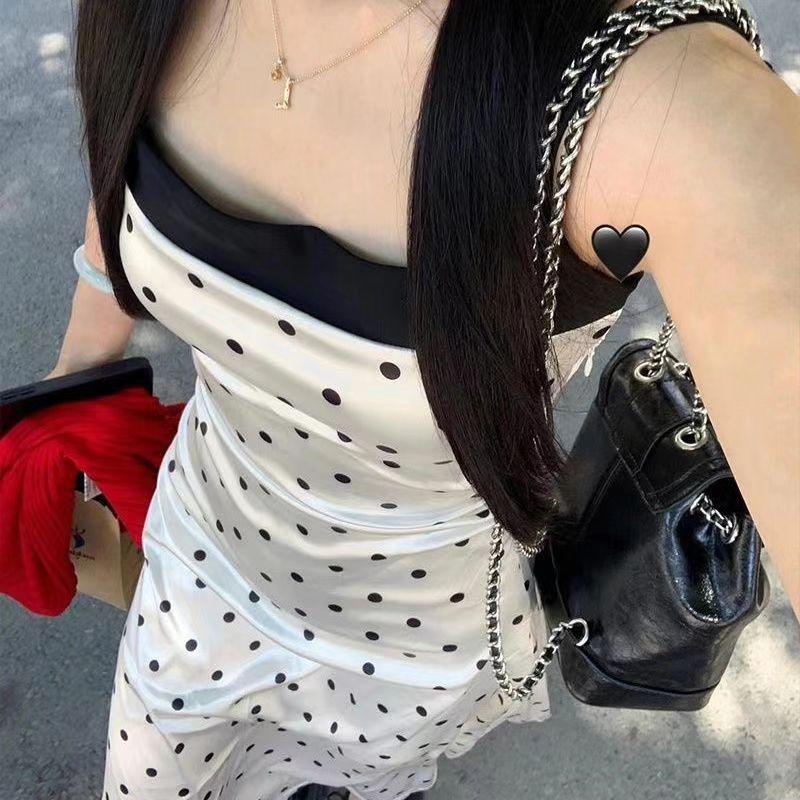 Pure desire style temperament polka dot suspender dress women's summer new design sense splicing waist showing thin long skirt tide
