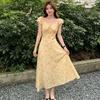 Yellow Short-sleeved Floral Dress Women's 2026 New Summer French V-neck Vacation Long Skirt High-end Skirt Tide