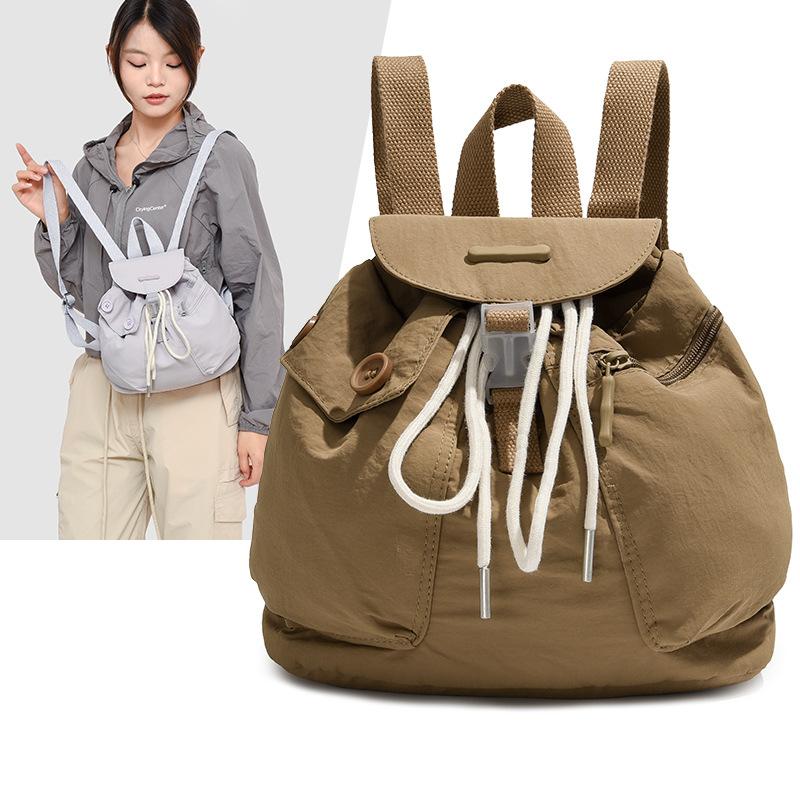 Schoolbag1011 new Korean ins women's niche design lightweight pocket button drawstring backpack outdoor nylon