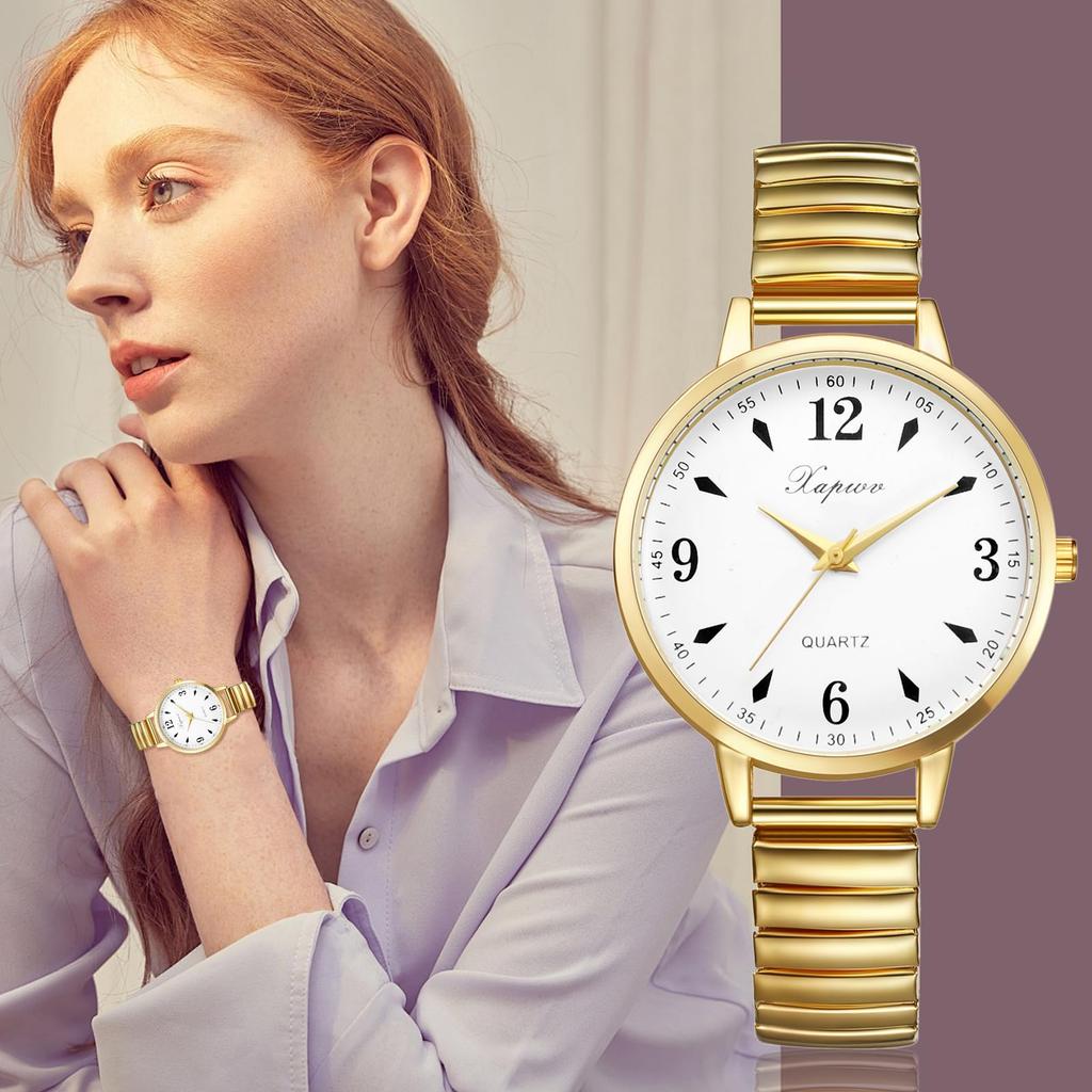 Women's waterproof and rainproof wristwatch with a round dial, large white dial, gold case, gold strap, and stainless steel quartz movement. A