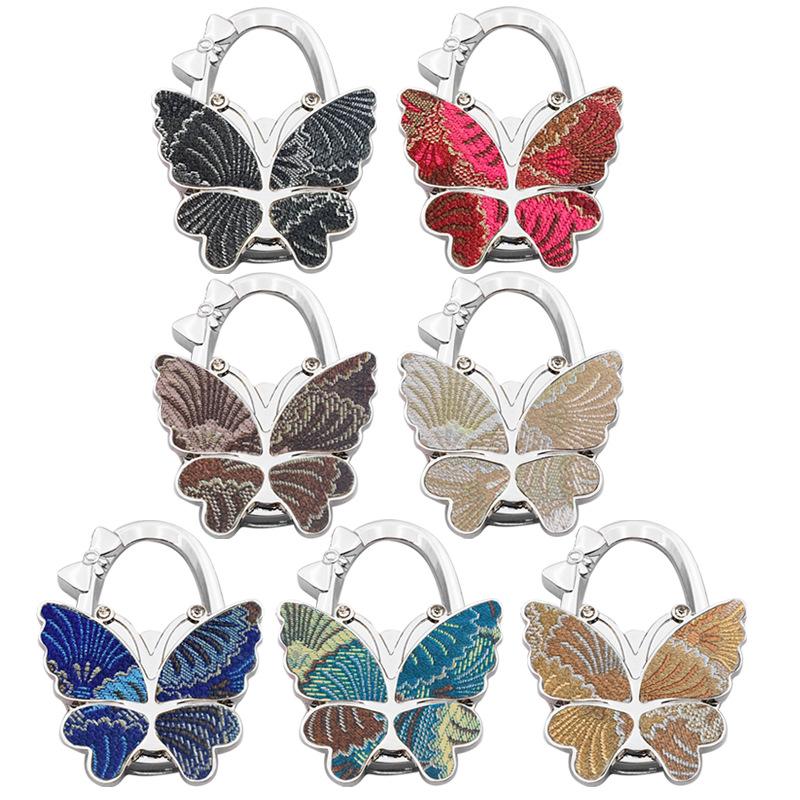 Large Matte Butterfly Hanging Bag Hook - Foldable Women's Bag Buckle & Portable Table Edge Hook for Luggage Accessories.