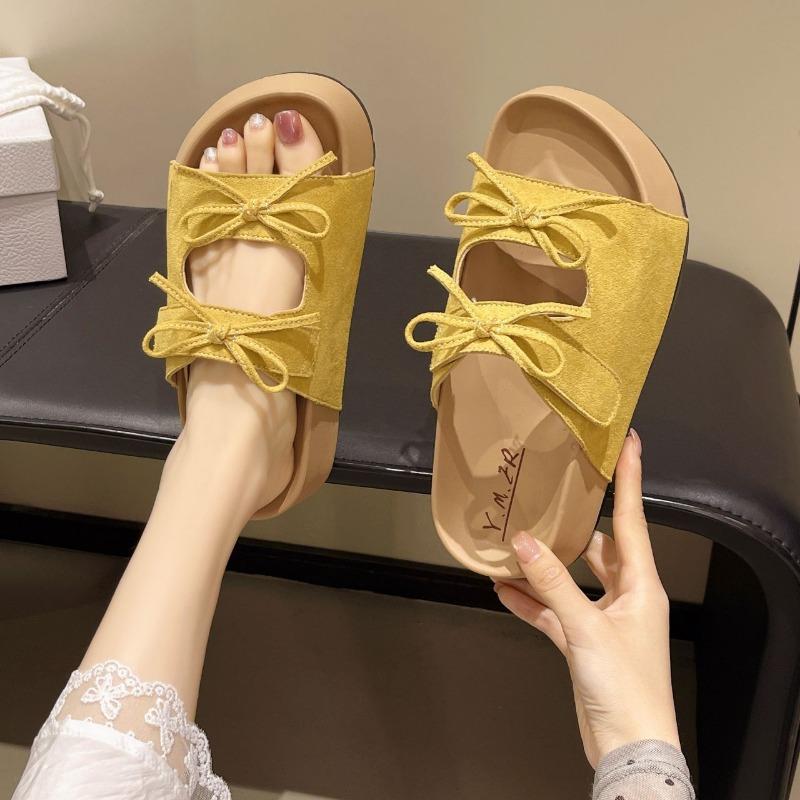 Thick-bottomed bow-tied cool slippers for women's summer wear, new versatile, comfortable and cute soft-bottomed one-word drag