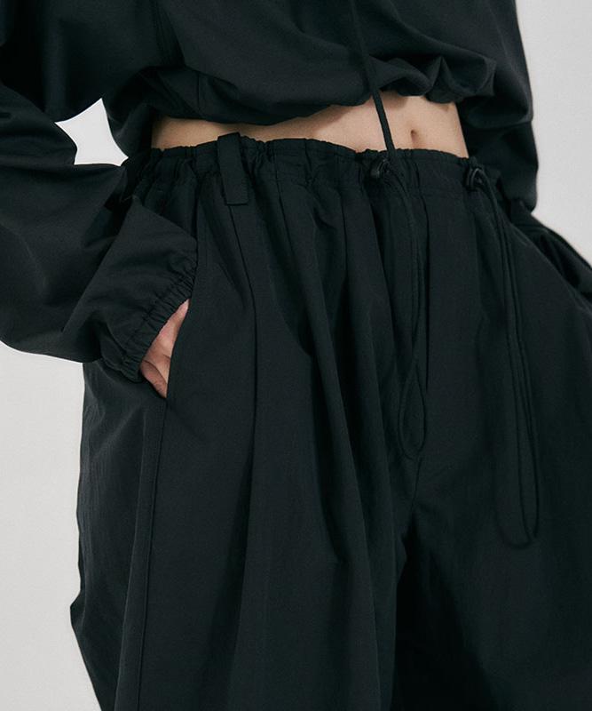 Sseodeupeulojegteu Curve Drawstring Pants Black