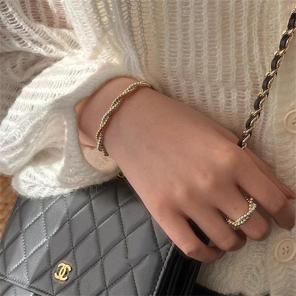 Gold and silver contrasting color round bead interwoven ring cold wind niche temperament light luxury simple elastic rope ring