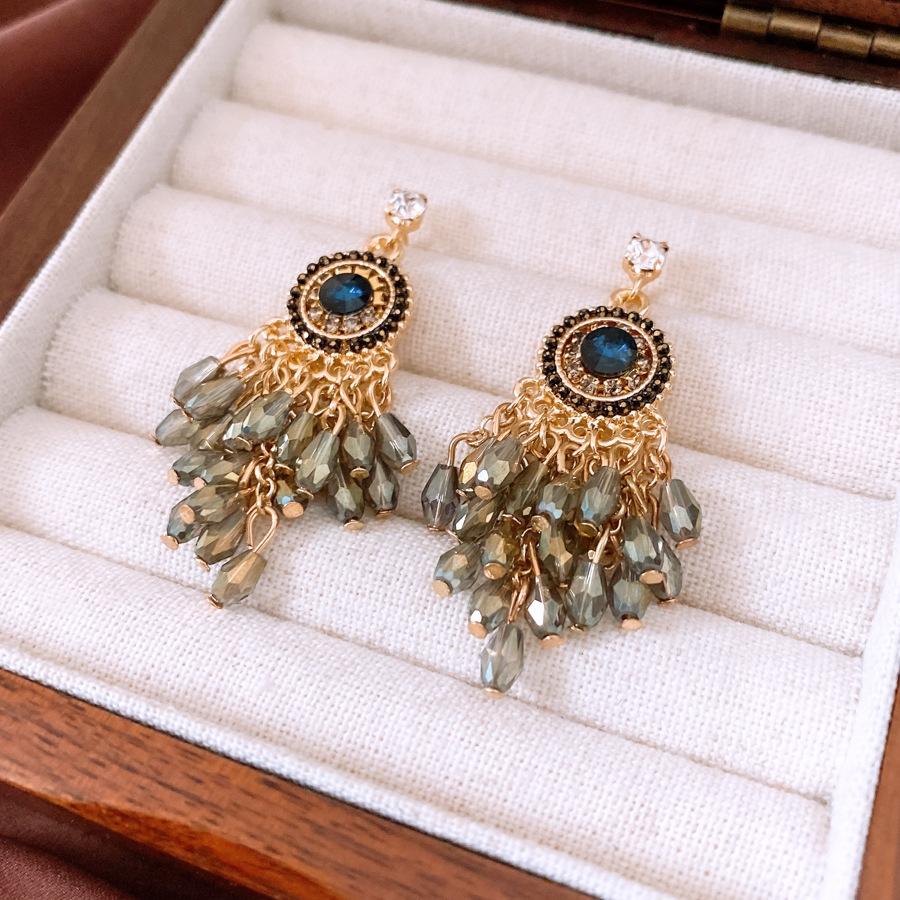 

Bohemian Red Zircon Earrings Women s High-end Stud Earrings Niche Earrings Mosquito Coil Disc