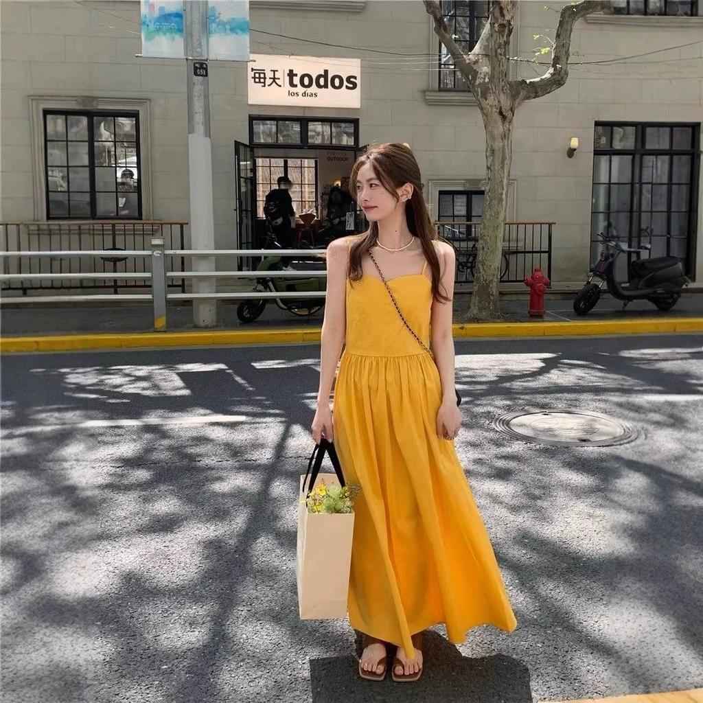 Dopamine yellow sleeveless suspender dress women's summer French feeling seaside vacation super fairy beach skirt women's clothing
